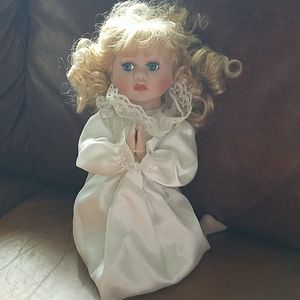 Praying doll for display